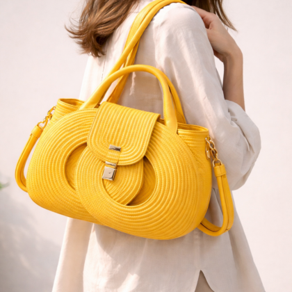 Yellow infinity handbag worn on shoulder, handwoven cotton cord structured bag with double handles and detachable strap