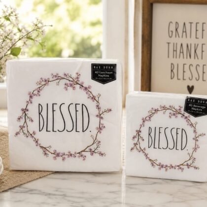 Rae Dunn Blessed floral napkin bundle styled on brunch table Floral wreath Blessed napkins close-up detail Rae Dunn farmhouse-style luncheon and beverage napkins set Spring floral paper napkins for tea party or shower Rae Dunn Blessed napkins arranged for entertaining table