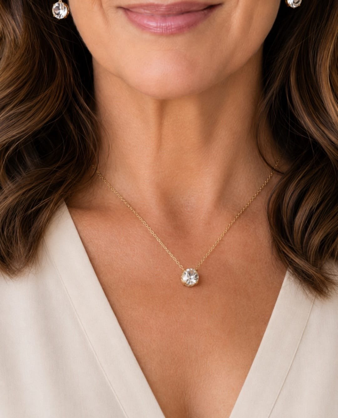 Kate Spade gold-tone crystal pendant necklace with clear crystal drop on delicate 18-inch chain.