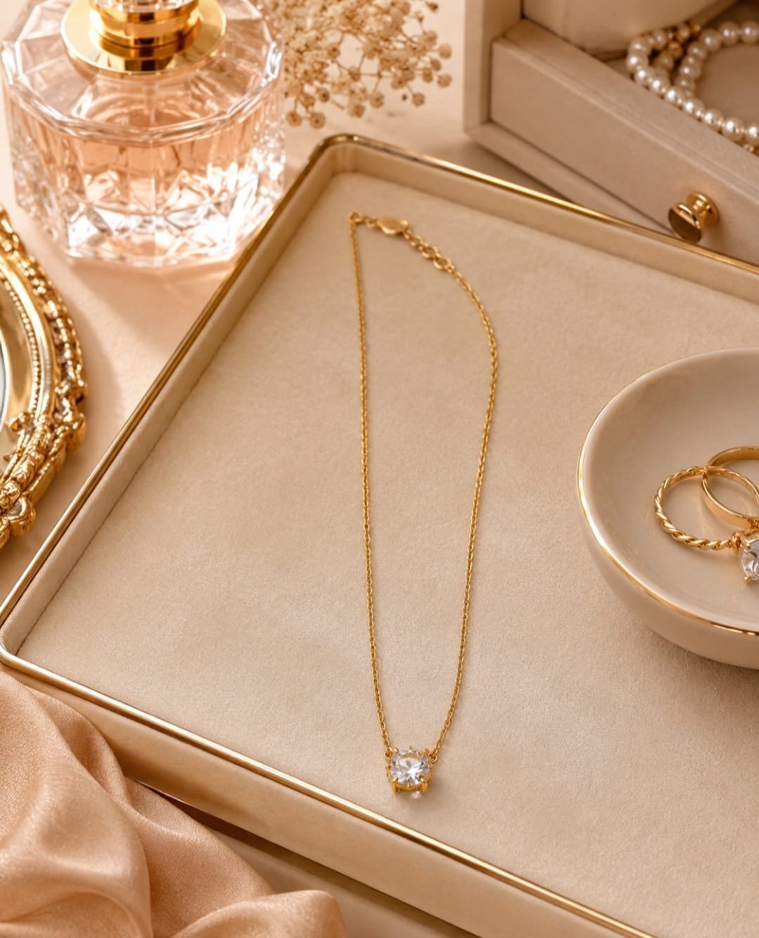 Kate Spade gold-tone crystal pendant necklace with clear crystal drop on delicate 18-inch chain.