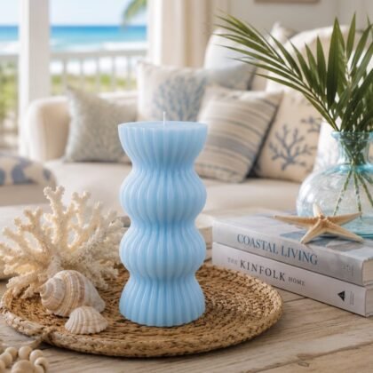 Sky blue sculptural candle with modern ribbed design displayed as a decorative home accent.