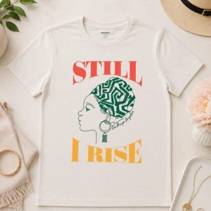 Old Navy “Still I Rise” graphic tee with Afrocentric-inspired illustration and bold multicolor lettering on cream background.
