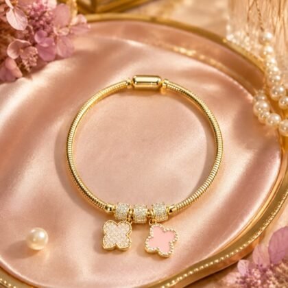 Gold CZ clover charm bracelet with pink and crystal-inspired double-sided clover charms