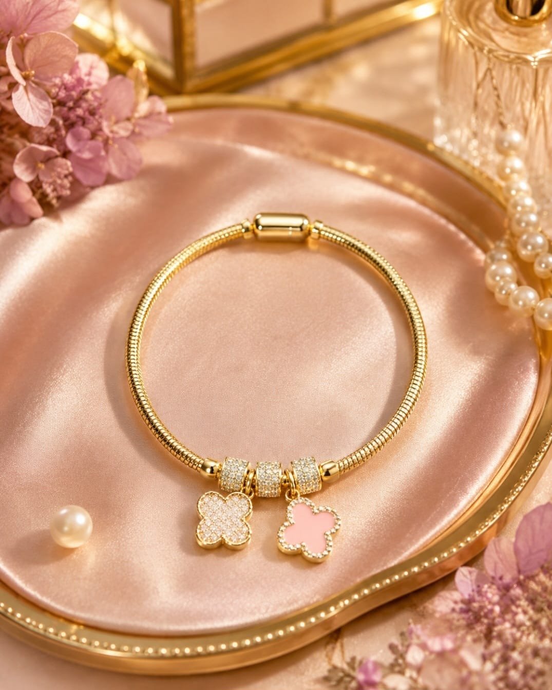 Gold CZ clover charm bracelet with pink and crystal-inspired double-sided clover charms
