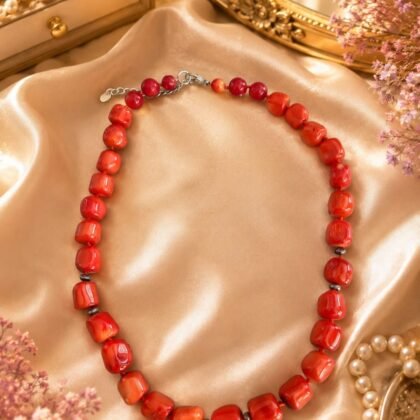 Coral Radiance coral beaded necklace with glossy red-orange beads and sterling silver marked 925 tag