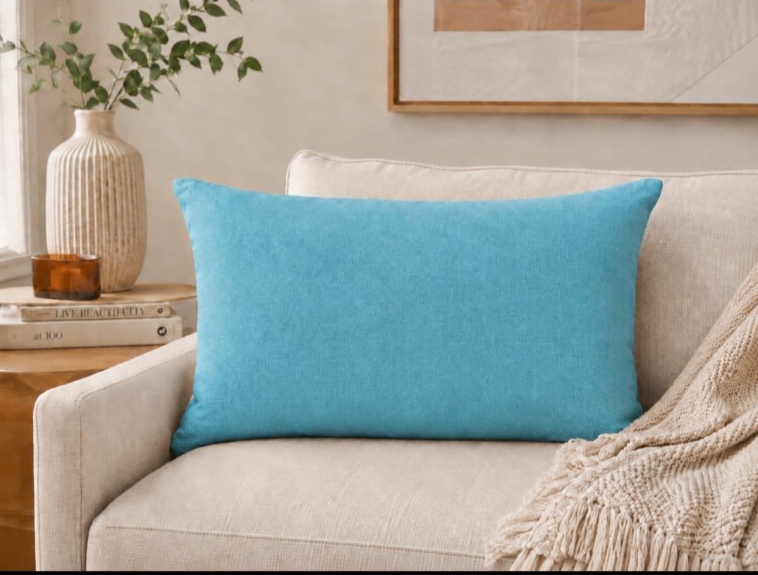 THRO Home 14 × 24 decorative pillow featuring colourful artistic portraits of women in coral, teal, blush, brown, and black.